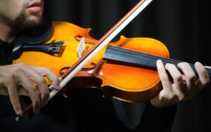 A close up of violinist playing violin