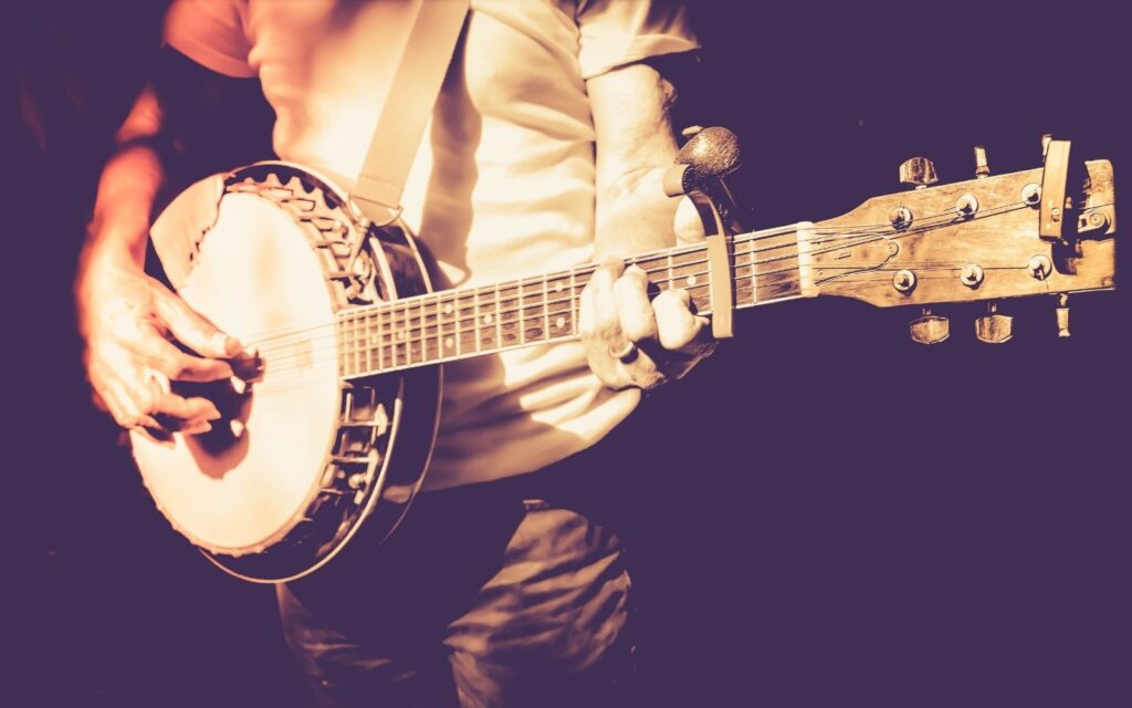 A musician strumming his banjo