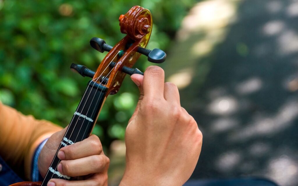 A musician tuning his violin