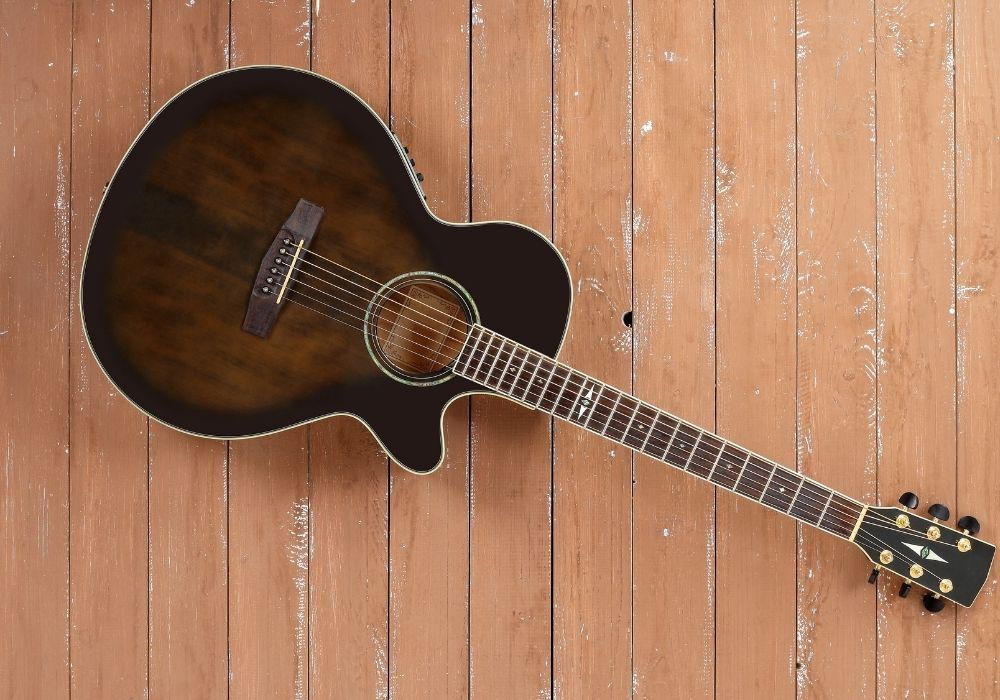 Close up of a color black acoustic electric guitar