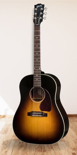 Gibson J-45 Standard Acoustic-Electric on wood floor with white wall background