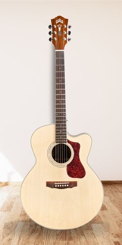 Guild F-150CE Westerly Jumbo Acoustic-Electric in studio on hardwood floor with white wall as a background