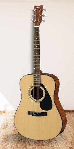 Yamaha Gig Maker Acoustic Guitar Pack on wooden floor with a white wall as the background