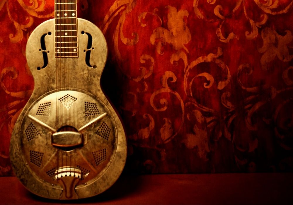 a resonator guitar on the wall
