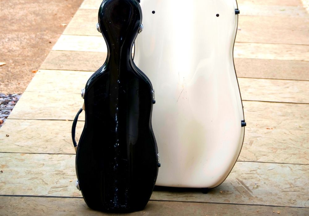 two cello cases color black and white
