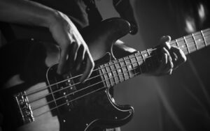 Closeup photo of bass guitar player hands