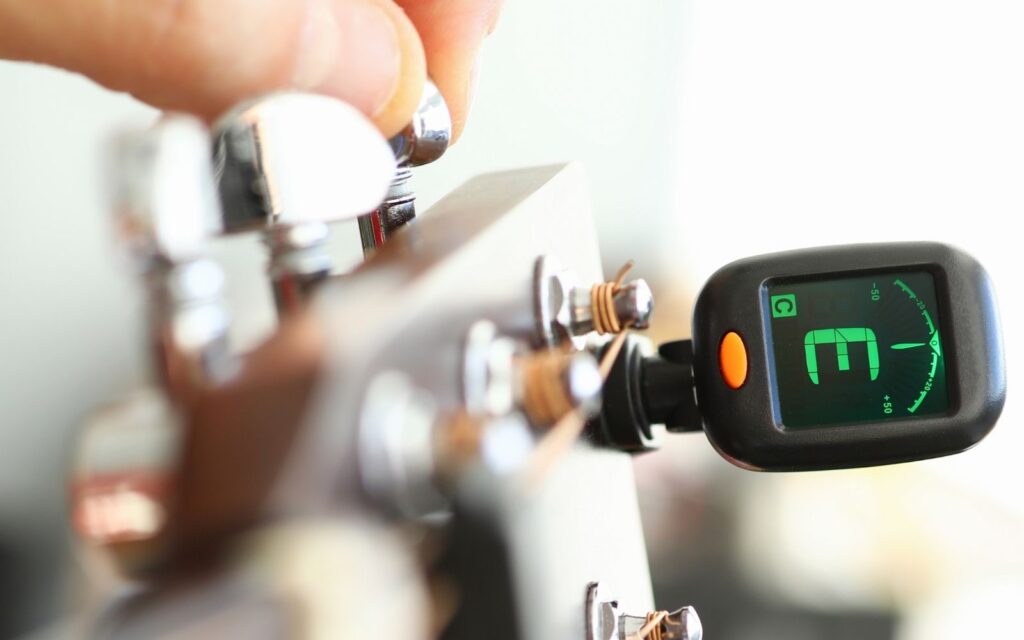 Tuner for an acoustic guitar.