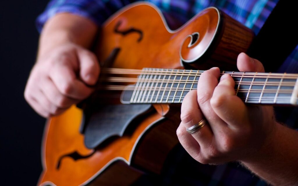 a musician paying a mandolin