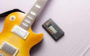 an electric guitar and a tuner