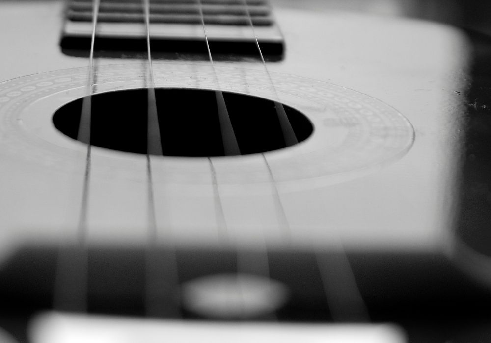 A ukulele in a white and black with selective focus