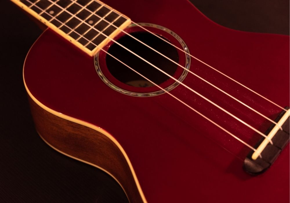 Fender Zuma red ukulele on the table