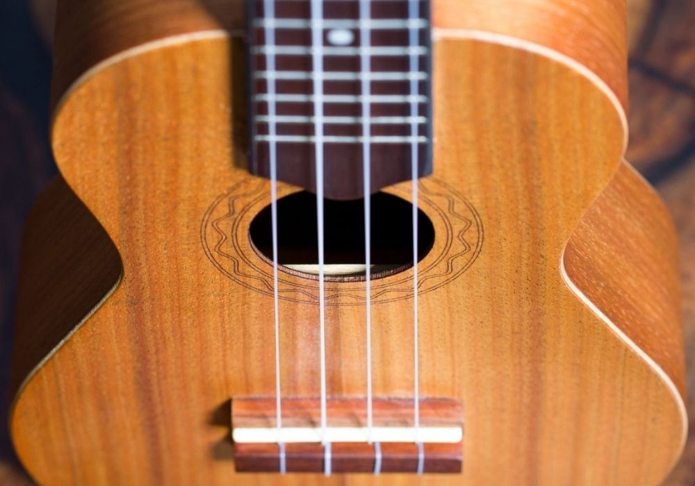 a soprano ukulele on a wooden table
