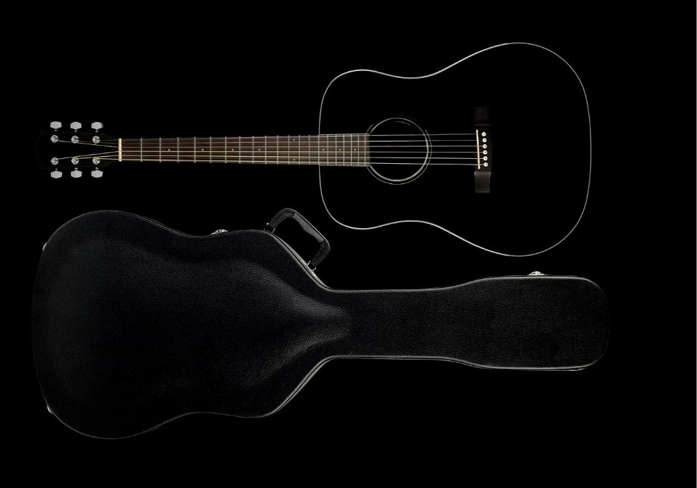 acoustic guitar case and an acoustic guitar with a dark background