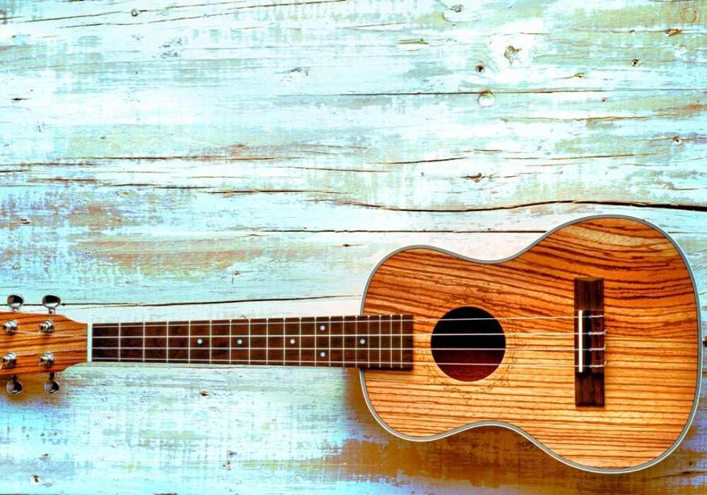 hawaiian concert ukulele on aged wood background