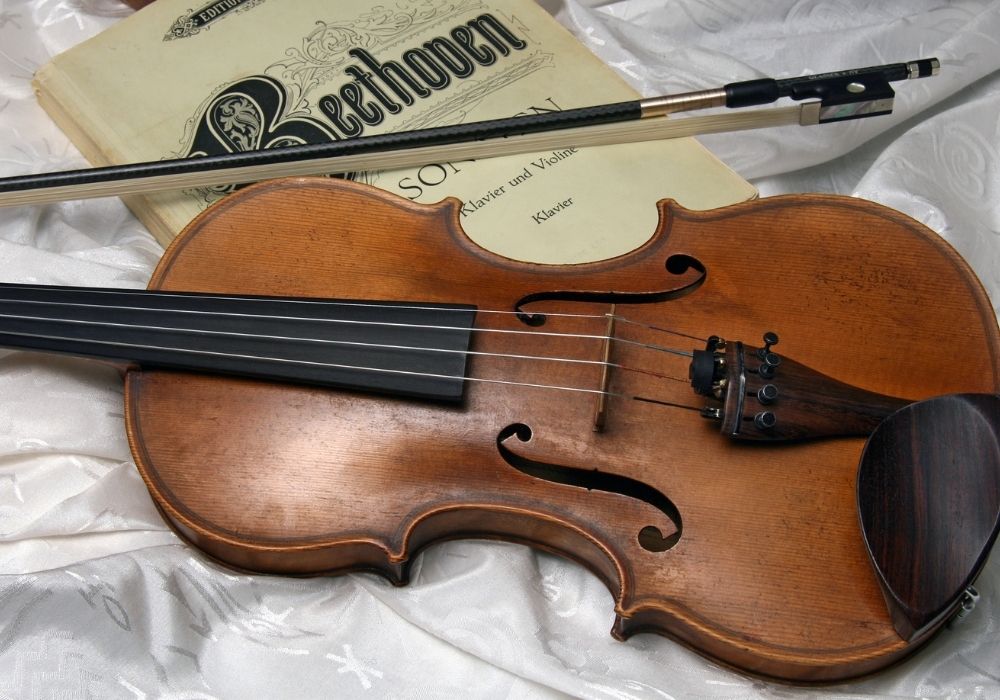 a violin on music books close-up