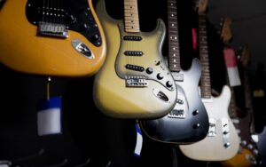 best electric guitars under 500 hanging on the wall