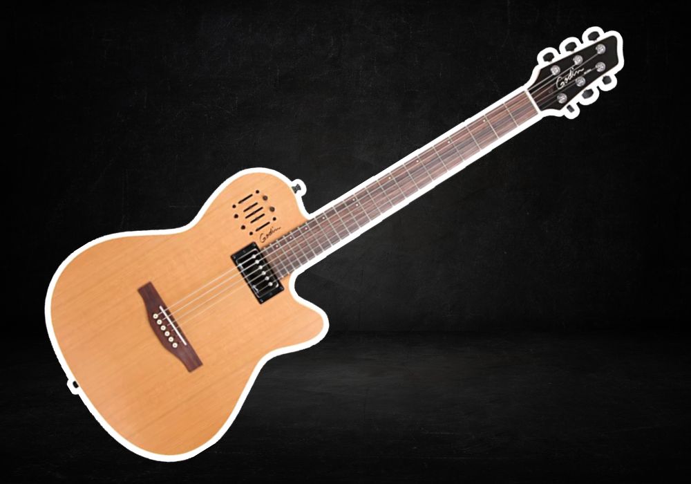 Guild acoustic guitar in color light brown on a black background.